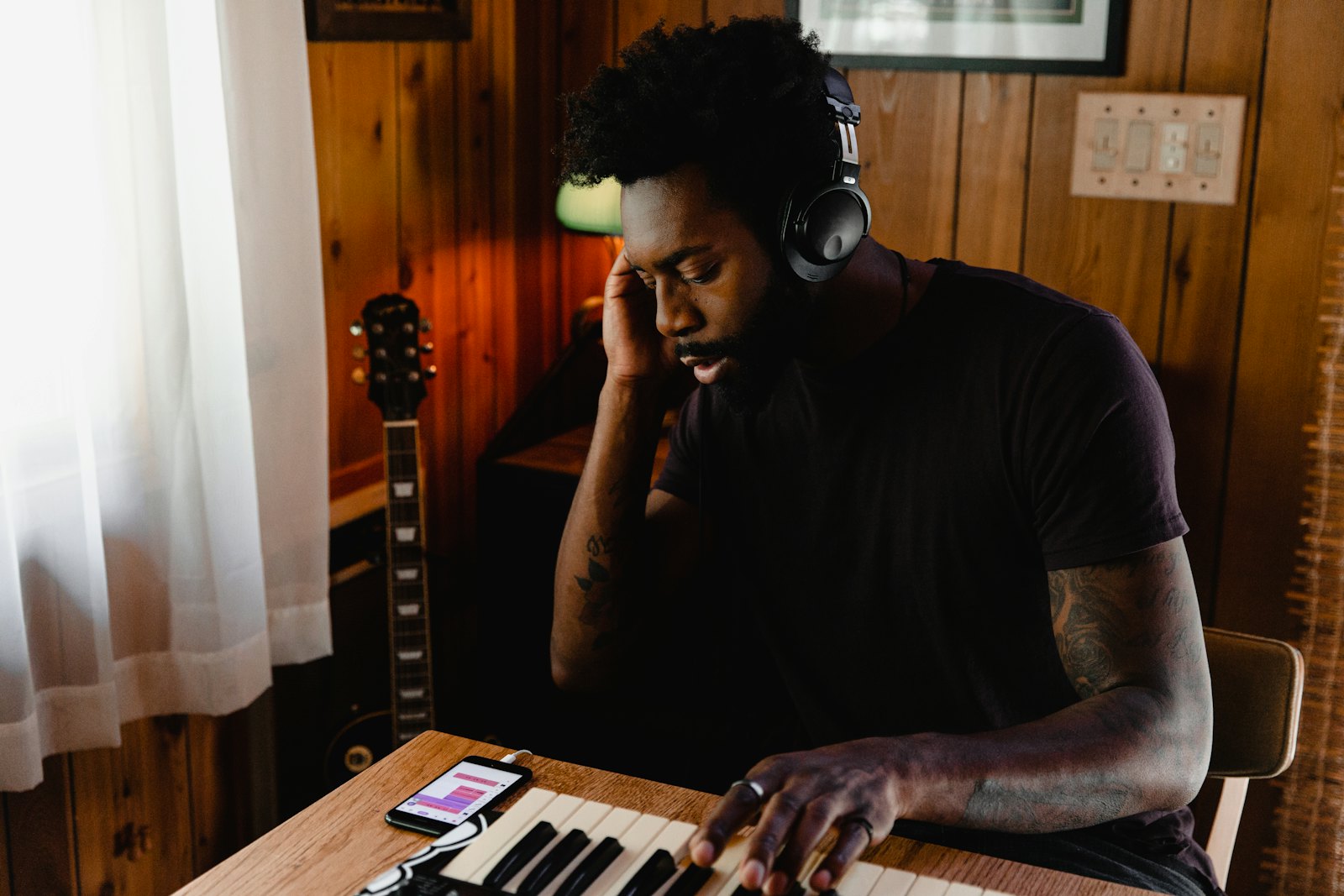 A musician playing keys at home